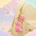 Pink Dino Keychain — Pastel Yellow Backpack Kawaii Scene